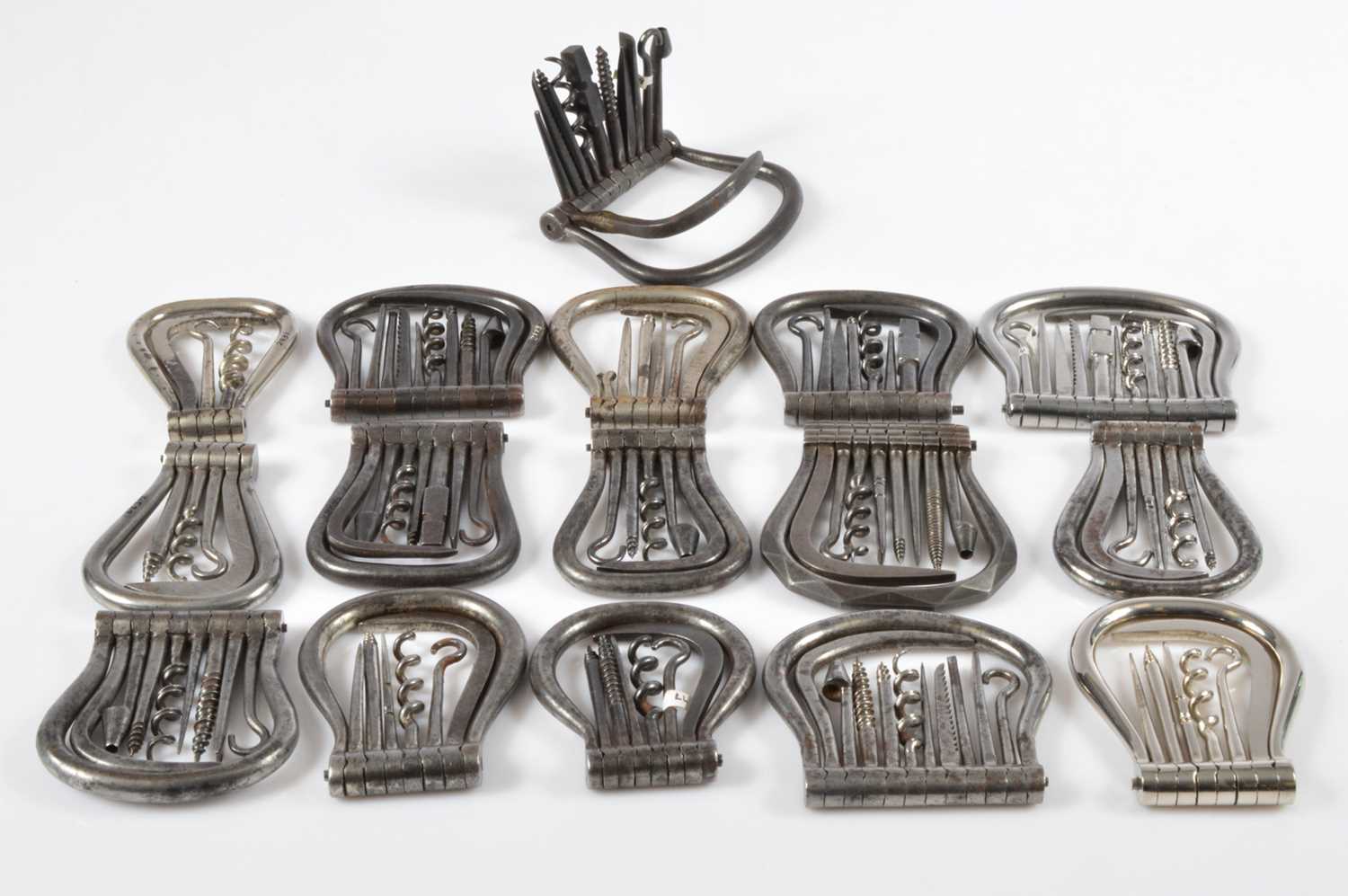 Lot 521 - A collection of 19th Century steel swivel hinge multi tools