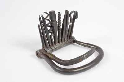 Lot 521 - A collection of 19th Century steel swivel hinge multi tools