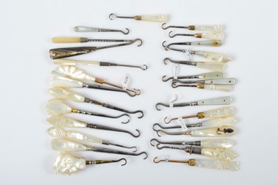 Lot 539 - Twenty eight mother of pearl, abalone and shell button or glove hooks