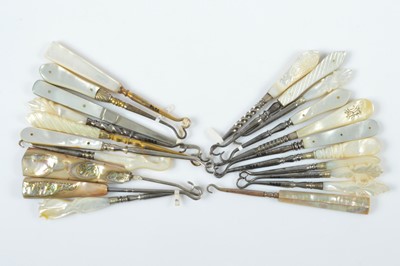 Lot 542 - Twenty one mother of pearl, abalone and shell carved handled button hooks