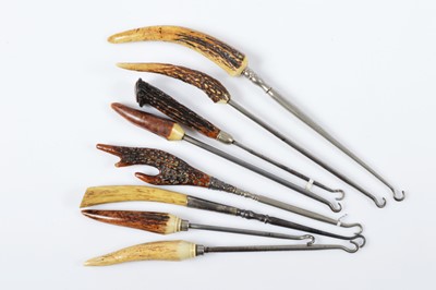 Lot 545 - Eight bone and horn handled steel button hooks