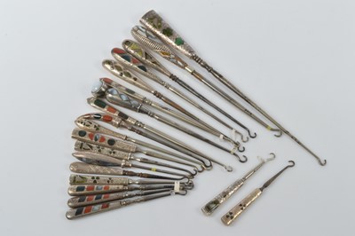 Lot 559 - A collection of silver handled steel button hooks