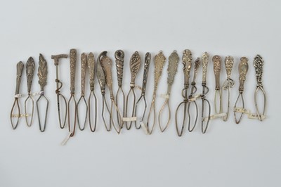 Lot 568 - A collection of small silver button or glove loops