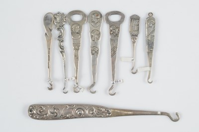 Lot 588 - Eight Sterling marked button hooks
