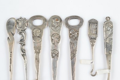 Lot 588 - Eight Sterling marked button hooks