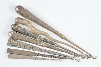 Lot 592 - A collection of silver button hooks