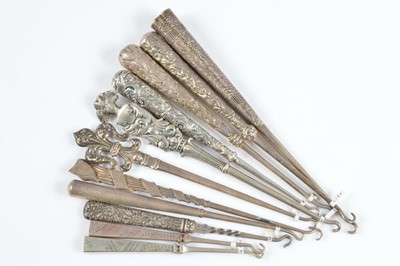 Lot 593 - A collection of silver button hooks