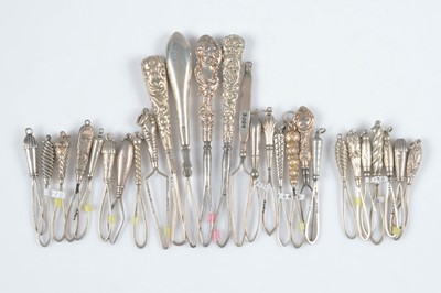 Lot 596 - A collection of silver handled button loops