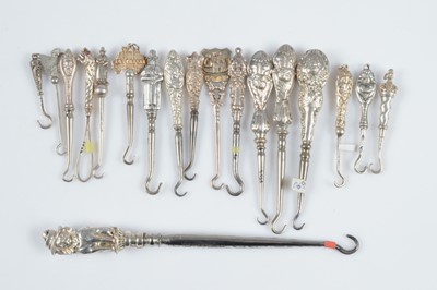 Lot 598 - A collection of novelty silver handled button hooks