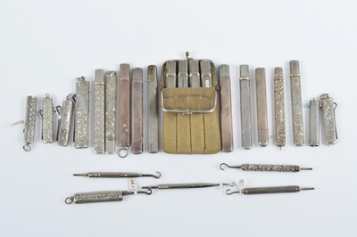 Lot 599 - A collection of flattened rectangular silver cased button hooks