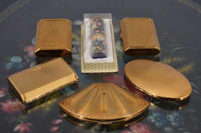 Lot 610 - Three gilt metal rectangular 1950s Melissa compacts
