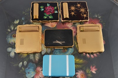 Lot 613 - Four 1950s gilt metal Stratton shaped rectangular duo compacts