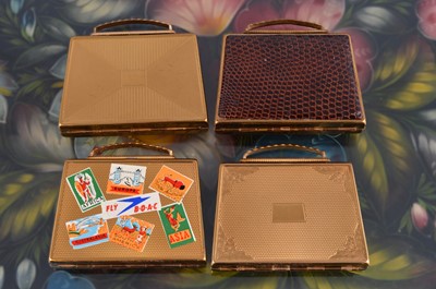 Lot 615 - Four 1950s gilt metal Mascot suitcase loose powder compacts
