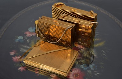 Lot 622 - Four rectangular gilt metal 1950s carryalls