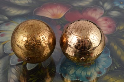 Lot 624 - Two 1950s Pygmalion gilt metal spherical globe compacts