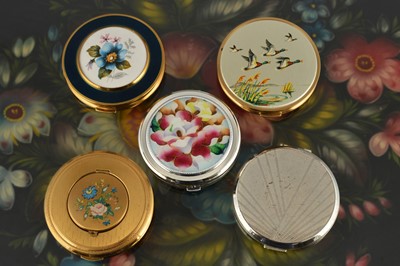 Lot 641 - Five circular 1950s and later cream powder compacts