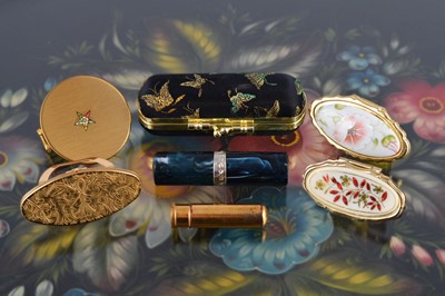Lot 646 - A collection of seven 1950s lipstick handbag accessories