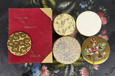 Lot 654 - Vintage Vogue gilt metal compacts