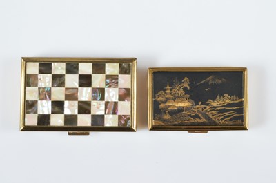 Lot 664 - Two Clover rectangular gilt metal musical compacts