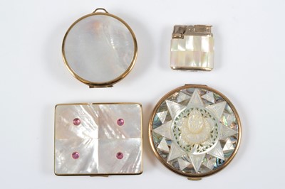 Lot 687 - Mother of pearl, shell and abalone mounted gilt metal vintage compacts