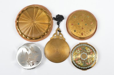 Lot 691 - Four circular 1950s Kigu compacts