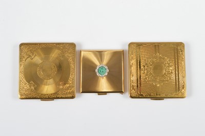 Lot 695 - Three gilt metal Kigu square compacts