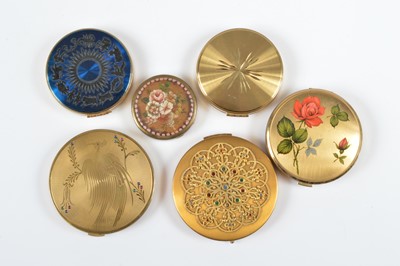 Lot 698 - Six circular gilt metal compacts