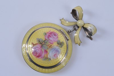 Lot 718 - A yellow guilloche enamel decorated silver brooch or pendant compact