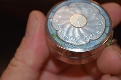 Lot 719 - Three circular silver blue guilloche enamel mounted compacts