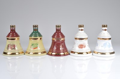 Lot 740 - A collection of five Bells 8 Year Old Christmas Decanters