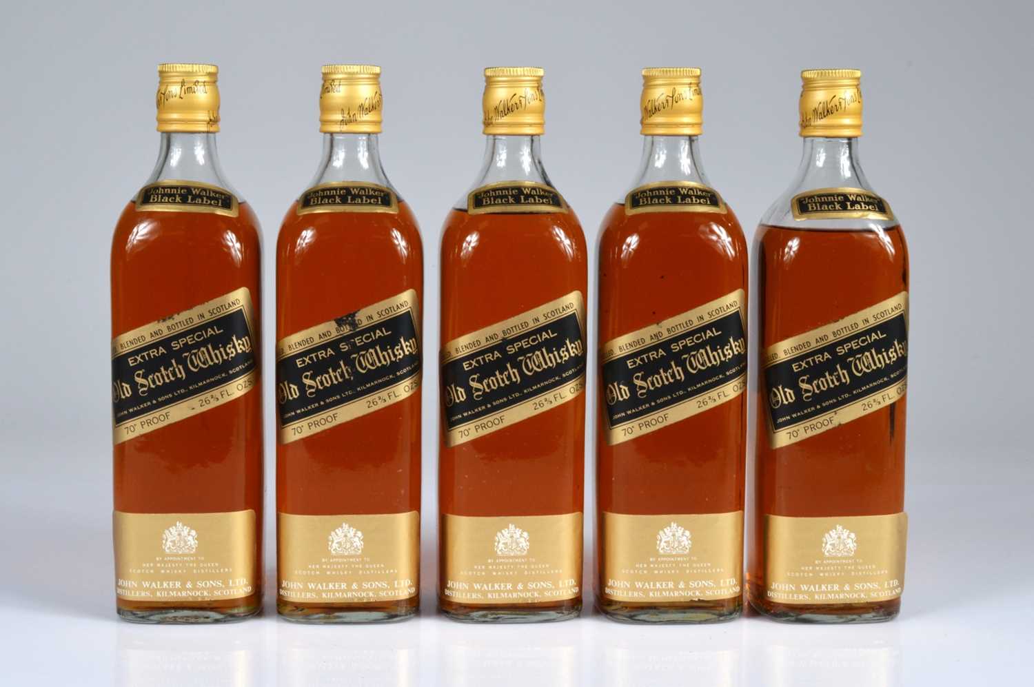 Lot 744 - A collection of five bottles of Johnnie Walker Black label