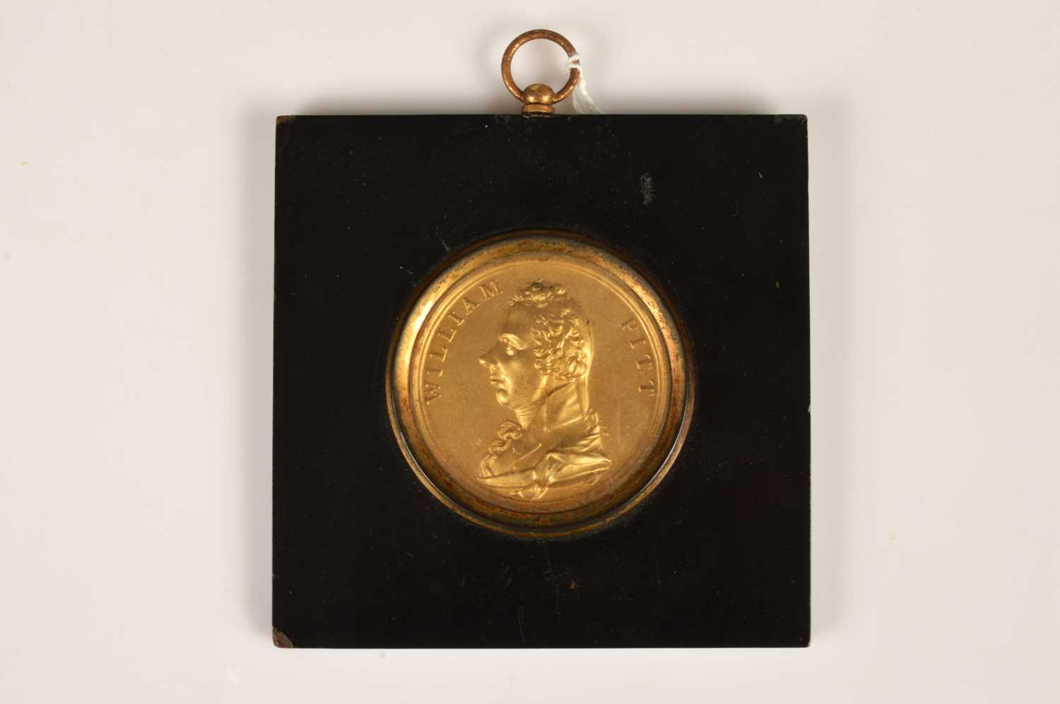 Lot 37 - A Regency Gilt-Brass Portrait Plaque of William Pitt in papier mâché frame circa 1806