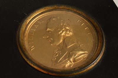 Lot 37 - A Regency Gilt-Brass Portrait Plaque of William Pitt in papier mâché frame circa 1806
