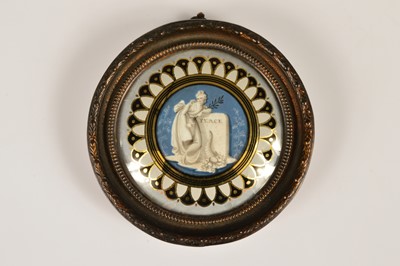 Lot 72 - A George III or Regency Era verre églomisé miniature commemorating "Peace" circa 1814