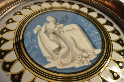 Lot 72 - A George III or Regency Era verre églomisé miniature commemorating "Peace" circa 1814