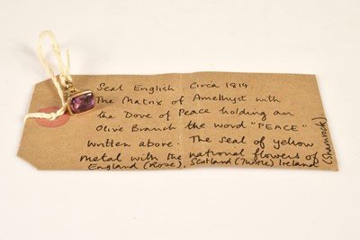 Lot 91 - A pinchbeck seal with a carved amethyst matrix commemorating 'Peace' circa 1814