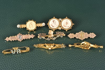 Lot 297 - A group of eight yellow metal and gilt Queen Victoria Diamond Jubilee Pin Brooches