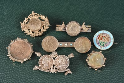 Lot 298 - A small collection of silver coin and medallion made Diamond Jubilee Commemorative Brooches