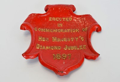 Lot 390 - A painted cast iron wall plaque
