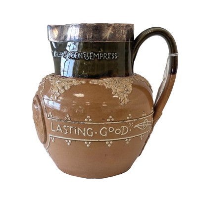 Lot 455 - A Doulton Lambeth Stoneware Silver rimmed water jug