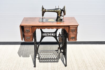 Lot 457 - A vintage Treadle Sewing Machine by Singer