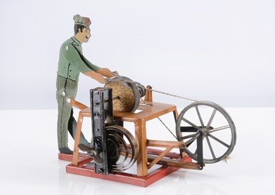 Lot 552 - An Arnold Tinplate Clockwork Working Model Scissor Grinder