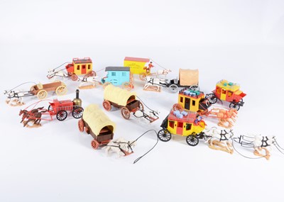 Lot 688 - A collection of loose Timpo plastic horse-drawn Wild West wagons comprising Clay County Jail Wagon and Fire Service