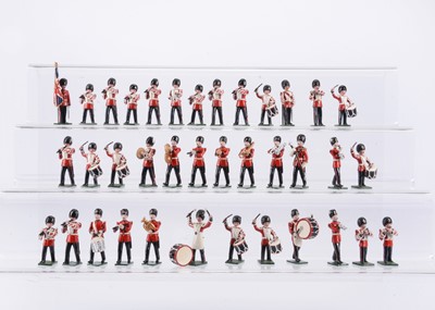 Lot 758 - Marlborough Military Models marching military band figures comprising Grenadier Guards marching Pipes & Drums Band (19), with standing flag bearer