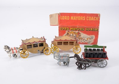 Lot 775 - Teeny Toys rare Lord Mayors Coach (2) including a boxed rare clockwork version coach and a clockwork version coal cart
