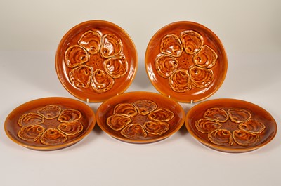Lot 5 - A set of five stoneware oyster dishes