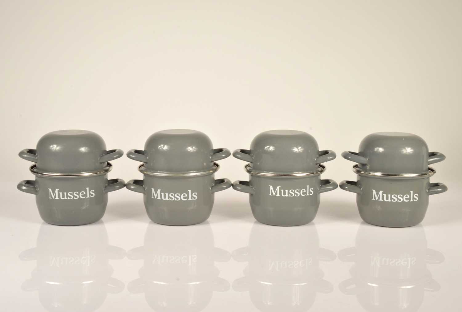 Lot 6 - A set of four enamel Mussel pots and covers