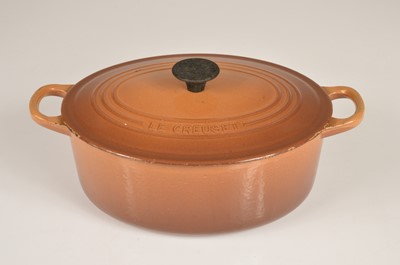 Lot 15 - A well loved and used Le Creuset dish and cover in brown