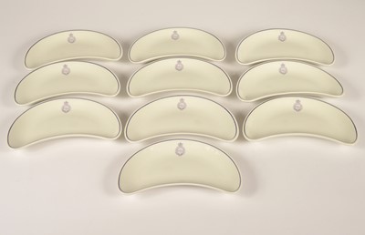 Lot 17 - A set of ten crescent shaped hotelware side dishes