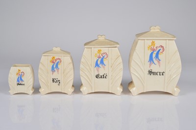 Lot 23 - A set of four art deco ceramic graduated condiment containers